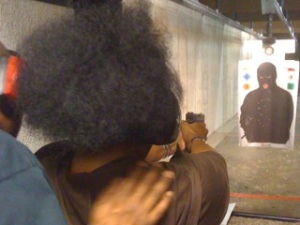 Instructor Leon S. Adams coaching a female shooting student during a recent ladies Only Handgun Safety Class